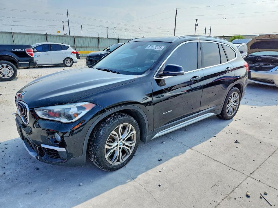 BMW X1 2017 with VIN WBXHT3Z30H4A53655 - Photo from auction