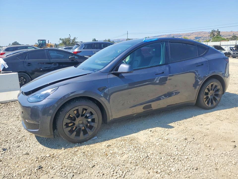 TESLA MODEL Y 2023 with VIN 7SAYGAEE6PF619760 - Photo from auction