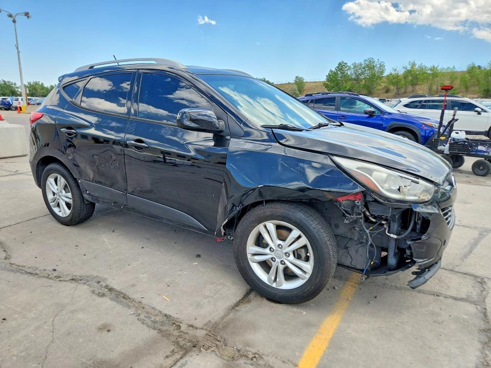 Photo 4 from auction – 2011 HYUNDAI TUCSON with VIN KM8JUCAC0BU257511