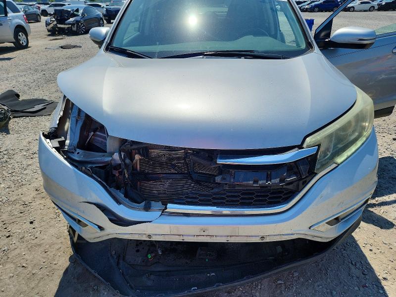 Photo 12 from auction – 2015 HONDA CR-V with VIN 5J6RM4H93FL058384