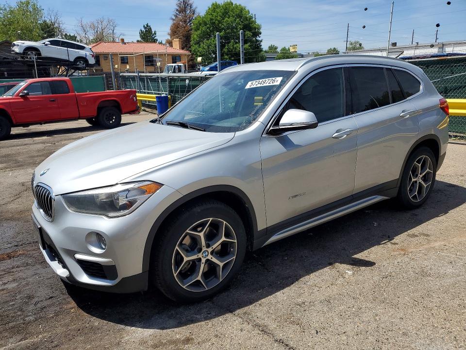 BMW X1 2018 with VIN WBXHT3C38J5F93201 - Photo from auction