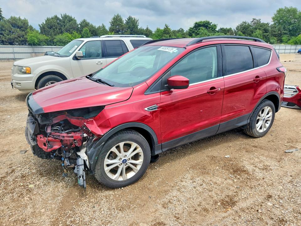 FORD ESCAPE 2018 with VIN 1FMCU0GD7JUC32336 - Photo from auction