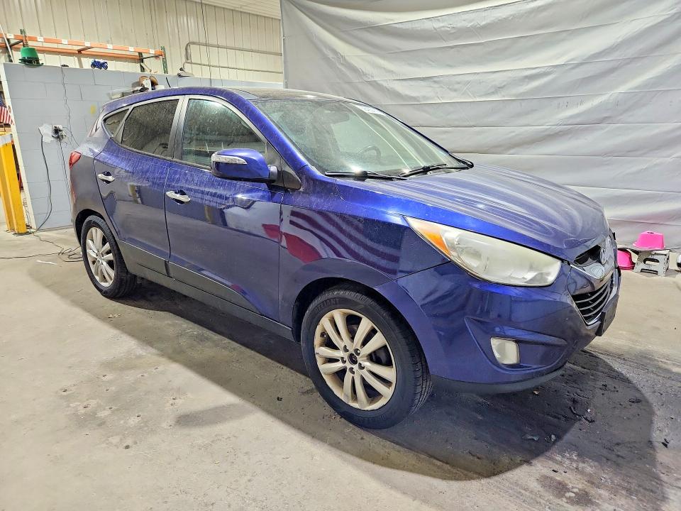 Photo 4 from auction – 2010 HYUNDAI TUCSON with VIN KM8JUCAC5AU024402