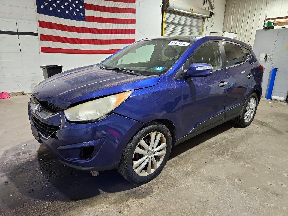 HYUNDAI TUCSON 2010 with VIN KM8JUCAC5AU024402 - Photo from auction