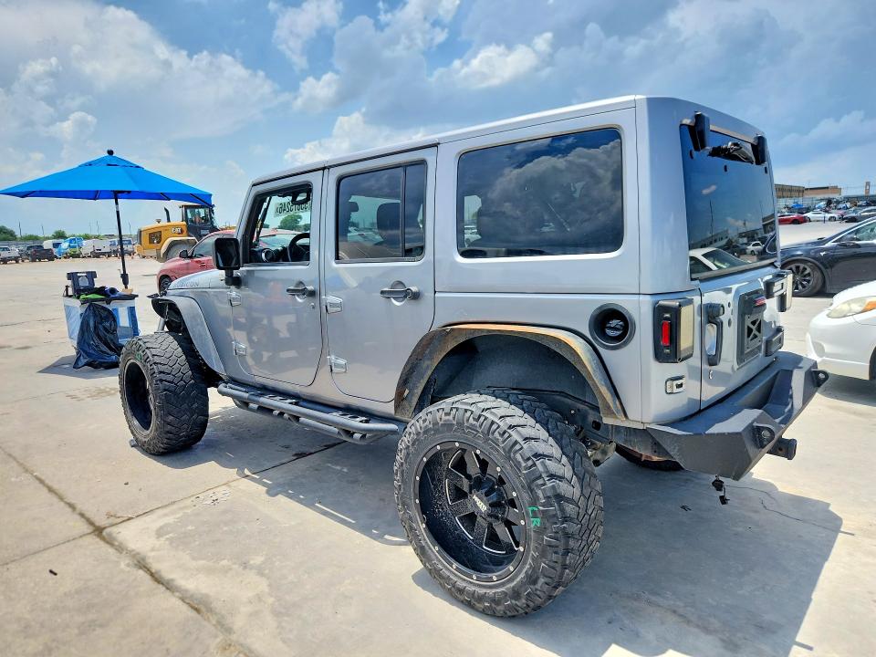 Снимка 2 от търг – 2014 JEEP WRANGLER UNLIMITED с VIN 1C4BJWFG9EL296929