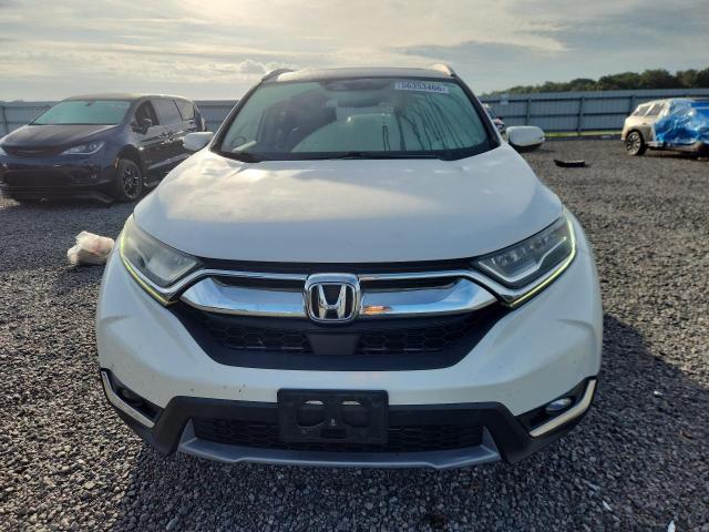 Photo 5 from auction – 2017 HONDA CR-V with VIN 5J6RW1H99HL016412