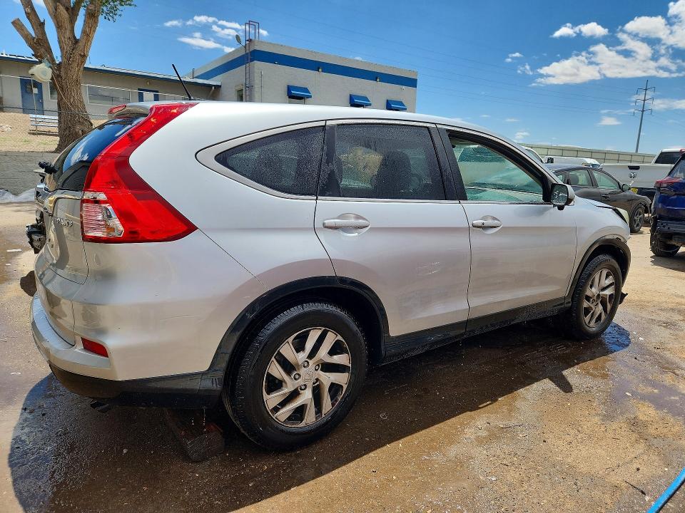 Photo 3 from auction – 2015 HONDA CR-V with VIN 2HKRM4H58FH677439