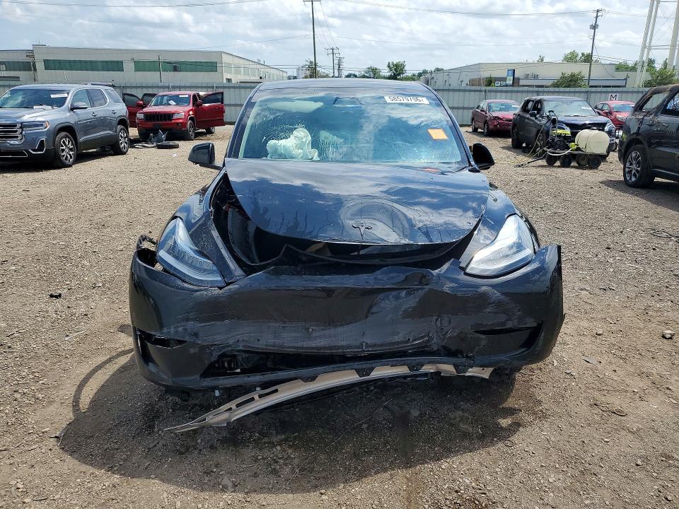Photo 5 from auction – 2022 TESLA MODEL Y with VIN 7SAYGDEEXNA017035