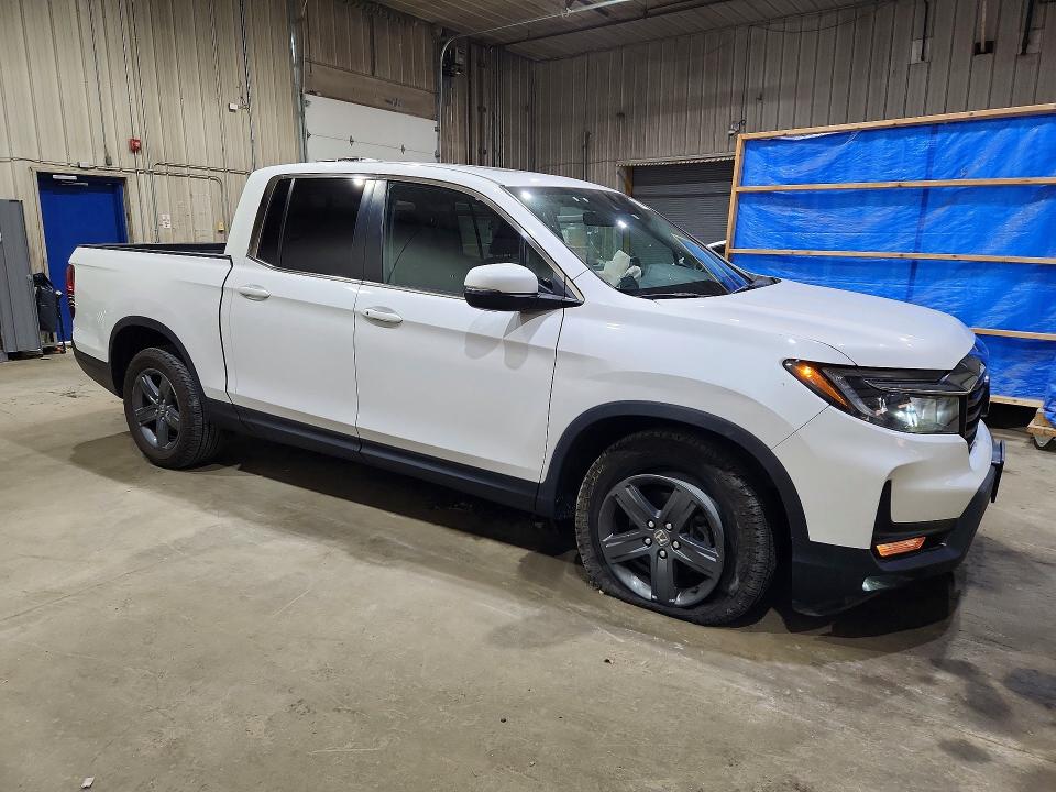 Photo 4 from auction – 2023 HONDA RIDGELINE with VIN 5FPYK3F50PB027378