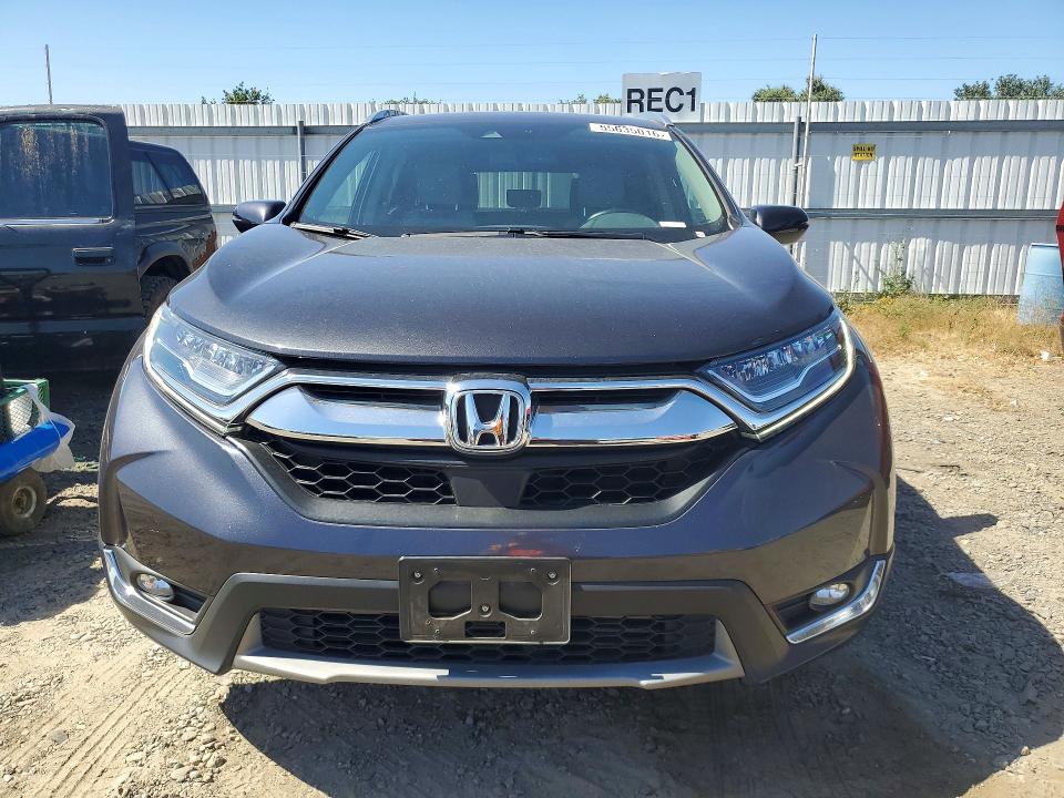 Photo 5 from auction – 2018 HONDA CR-V with VIN 7FARW1H90JE018049