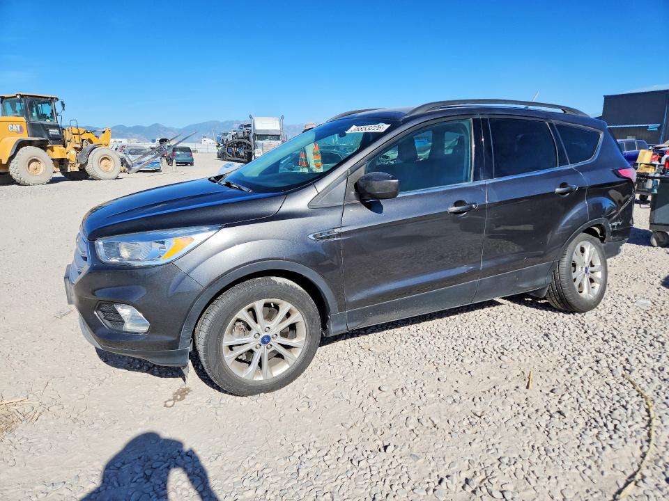FORD ESCAPE 2018 with VIN 1FMCU9GD3JUA99479 - Photo from auction