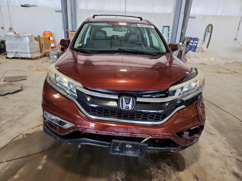 Photo 5 from auction – 2015 HONDA CR-V with VIN 2HKRM4H79FH616456