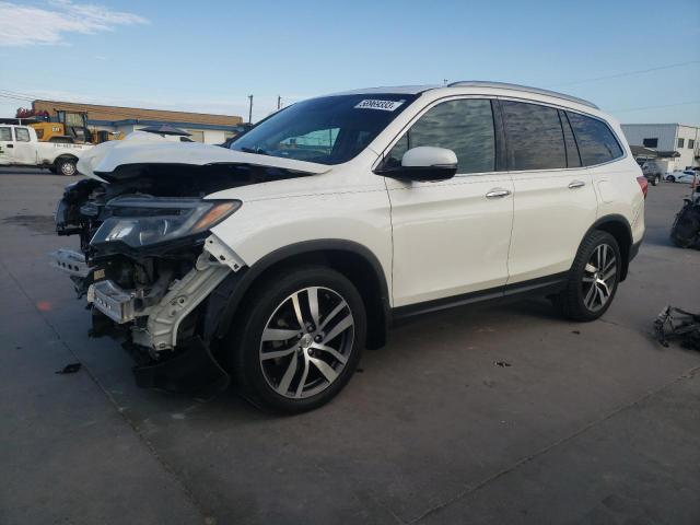 HONDA PILOT TOUR 2016 with VIN 5FNYF5H9XGB031592 - Photo from auction