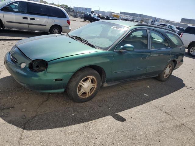 FORD TAURUS 1999 with VIN 1FAFP58U4XG174493 - Photo from auction