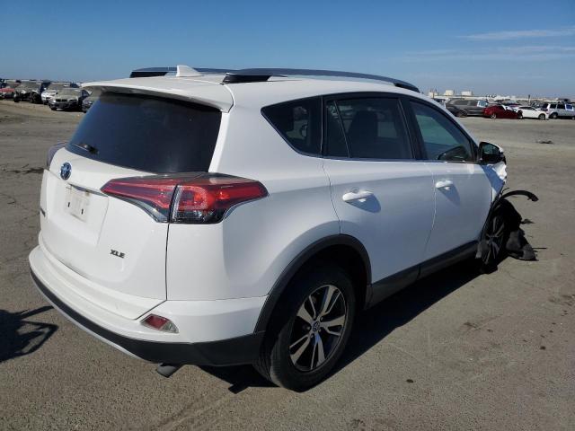 Photo 3 from auction – 2016 TOYOTA RAV4 XLE with VIN 2T3WFREV1GW304879