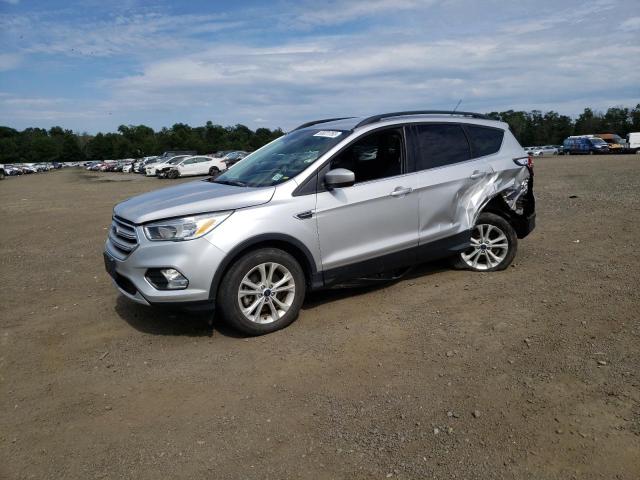 FORD ESCAPE SE 2018 with VIN 1FMCU9GD7JUC25990 - Photo from auction