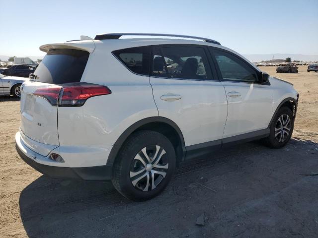 Photo 3 from auction – 2018 TOYOTA RAV4 LE with VIN JTMZFREV6JD112892