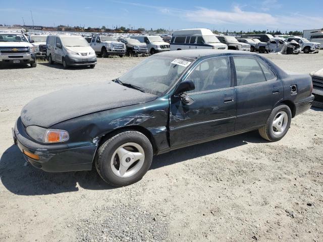 TOYOTA CAMRY DX 1995 with VIN 4T1SK11E7SU479219 - Photo from auction