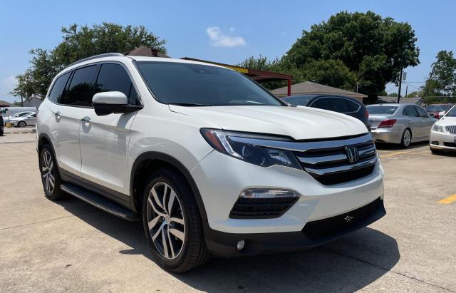 HONDA PILOT TOUR 2018 with VIN 5FNYF6H92JB000754 - Photo from auction