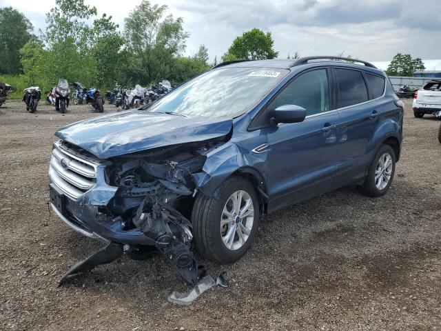 FORD ESCAPE SE 2018 with VIN 1FMCU9GDXJUA65443 - Photo from auction