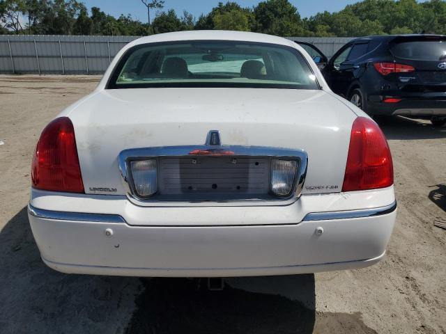 Photo 6 from auction – 2004 LINCOLN TOWN CAR E with VIN 1LNHM81W44Y654303