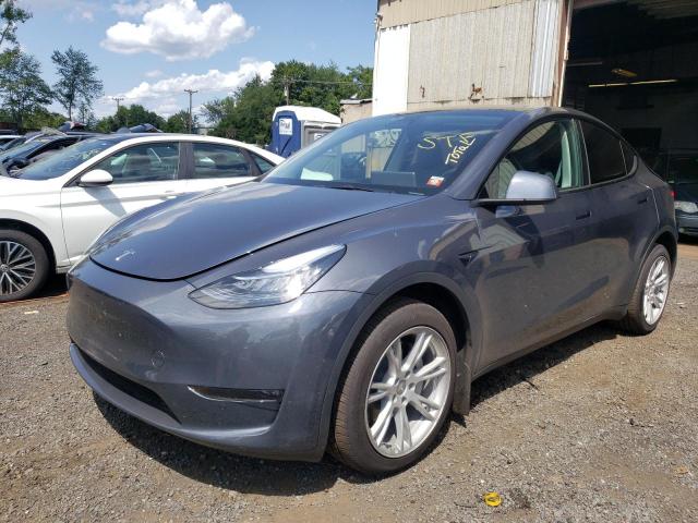 TESLA MODEL Y 2023 with VIN 7SAYGDEF4PA048857 - Photo from auction