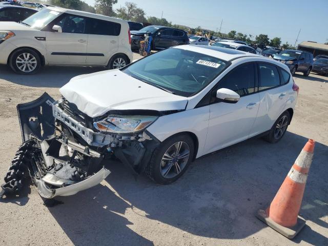 FORD FOCUS SE 2014 with VIN 1FADP3K29EL396440 - Photo from auction
