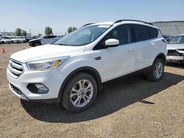 FORD ESCAPE SE 2018 with VIN 1FMCU9GD3JUA00241 - Photo from auction