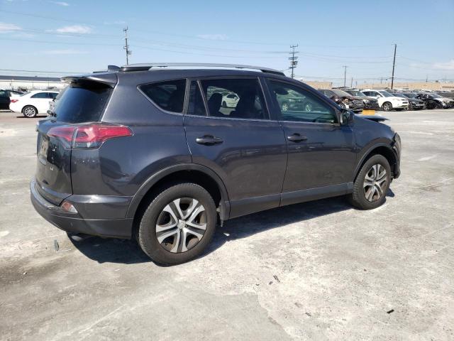 Photo 3 from auction – 2018 TOYOTA RAV4 LE with VIN JTMZFREV2JJ174789