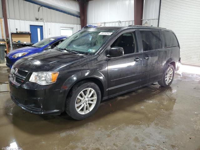 DODGE CARAVAN 2015 with VIN 2C4RDGCG9FR717105 - Photo from auction