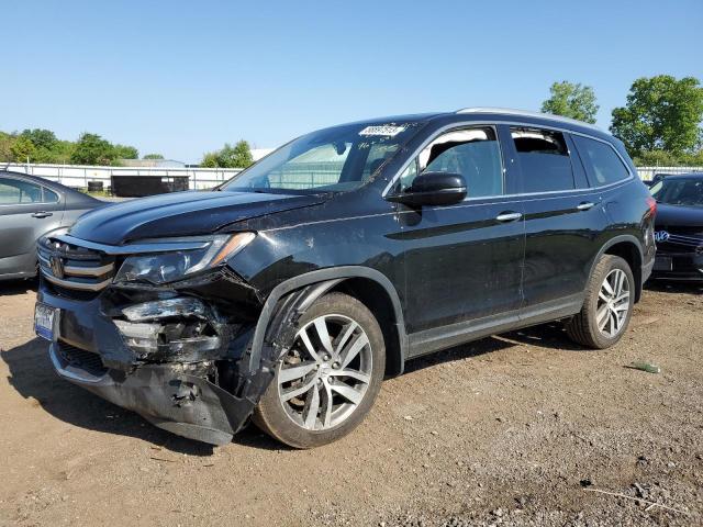 HONDA PILOT TOUR 2018 with VIN 5FNYF6H98JB009409 - Photo from auction