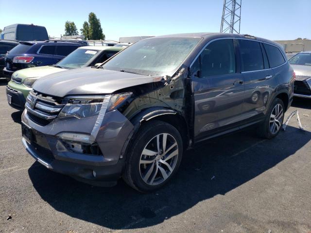 HONDA PILOT TOUR 2018 with VIN 5FNYF6H97JB044636 - Photo from auction