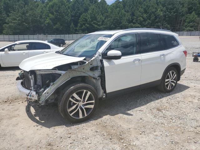 HONDA PILOT TOUR 2017 with VIN 5FNYF5H91HB018876 - Photo from auction