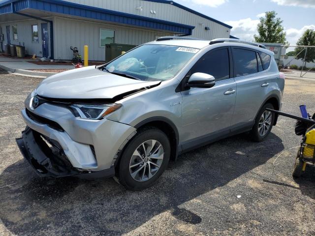 TOYOTA RAV4 HV LE 2018 with VIN JTMRJREV2JD239783 - Photo from auction
