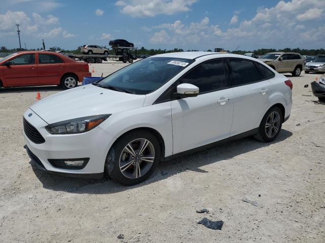 FORD FOCUS SE 2017 with VIN 1FADP3FE0HL282352 - Photo from auction