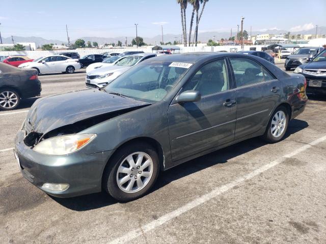 TOYOTA CAMRY LE 2004 with VIN 4T1BF30K84U074660 - Photo from auction