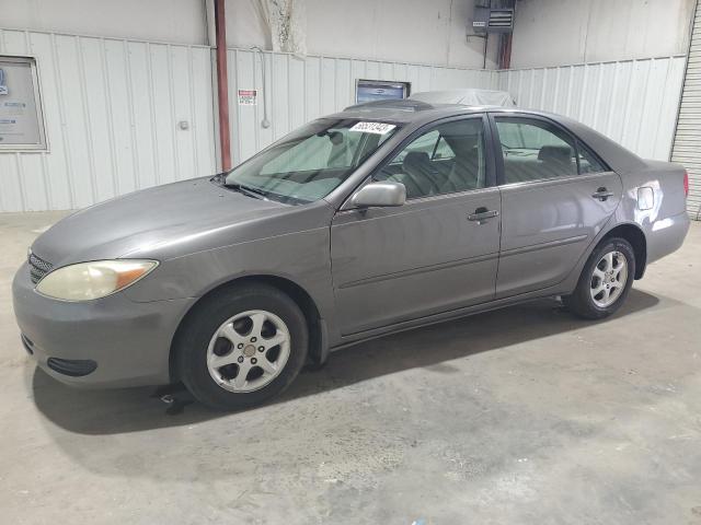 TOYOTA CAMRY LE 2002 with VIN JTDBE32K120012865 - Photo from auction