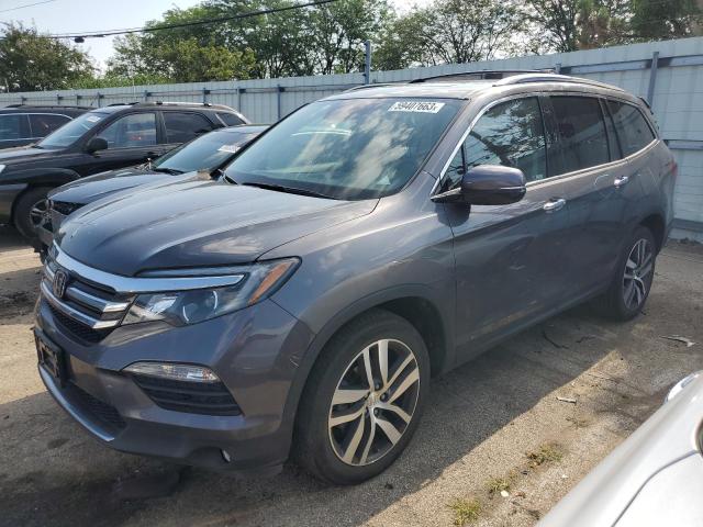 HONDA PILOT TOUR 2018 with VIN 5FNYF6H98JB039042 - Photo from auction