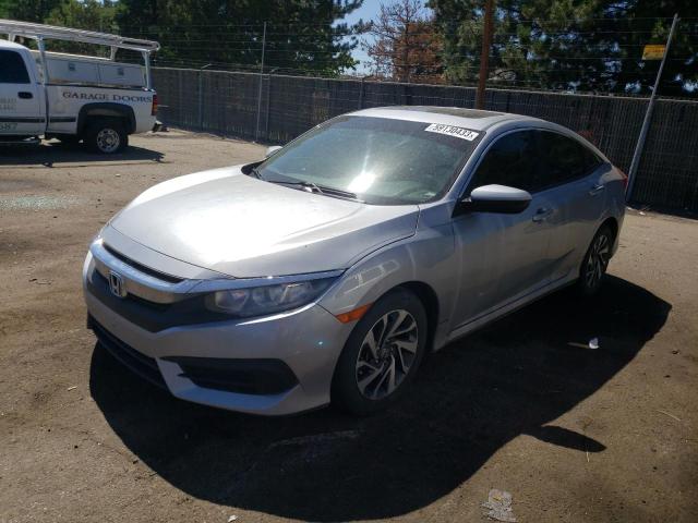HONDA CIVIC EX 2018 with VIN 19XFC2F70JE023207 - Photo from auction