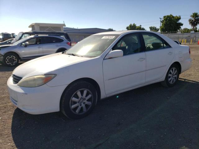 TOYOTA CAMRY LE 2002 with VIN 4T1BF30K02U027863 - Photo from auction