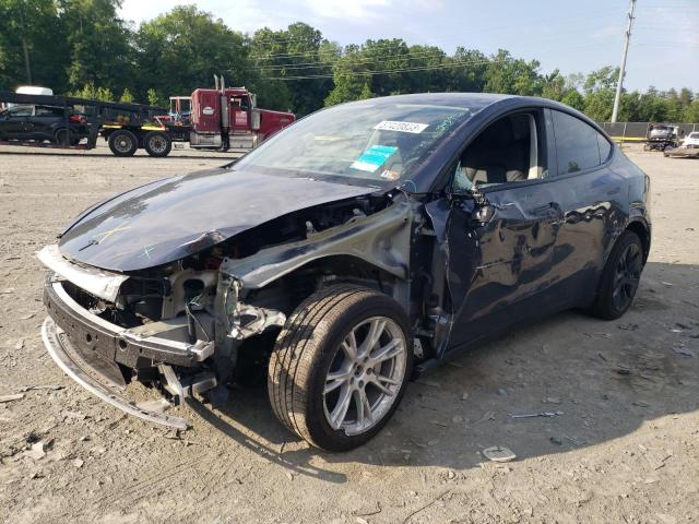 TESLA MODEL Y 2023 with VIN 7SAYGAEE0PF639017 - Photo from auction