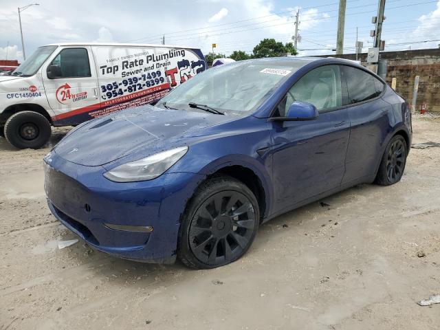TESLA MODEL Y 2023 with VIN 7SAYGAEE0PF766446 - Photo from auction