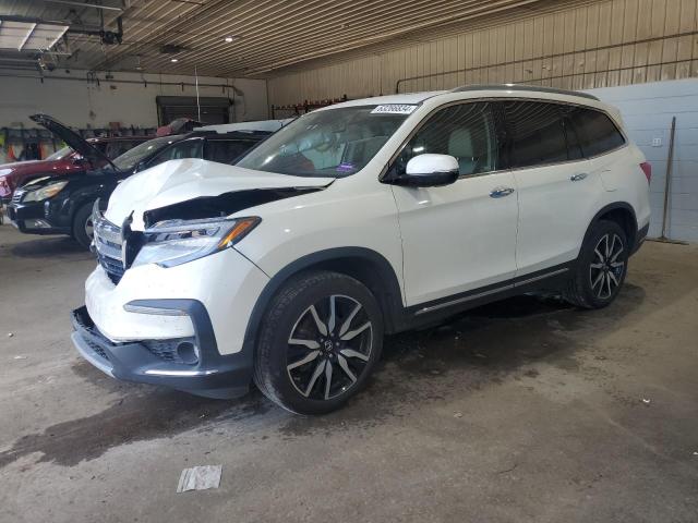 HONDA PILOT TOUR 2019 with VIN 5FNYF6H69KB035122 - Photo from auction