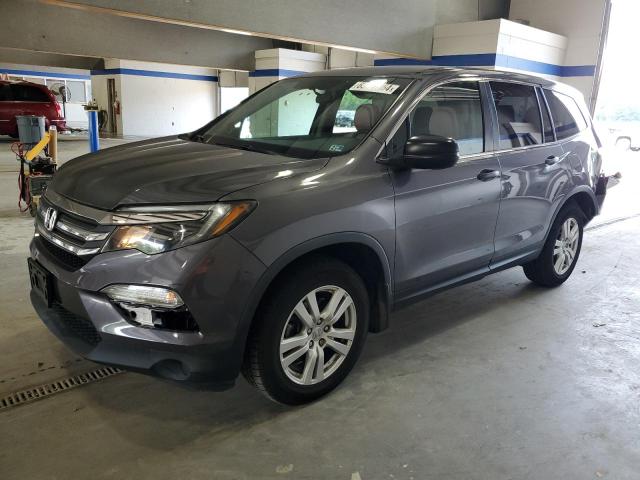 HONDA PILOT LX 2018 with VIN 5FNYF6H14JB044121 - Photo from auction