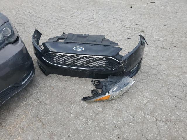 Foto 12 de la subasta – 2015 FORD FOCUS SE con VIN 1FADP3K28FL260544