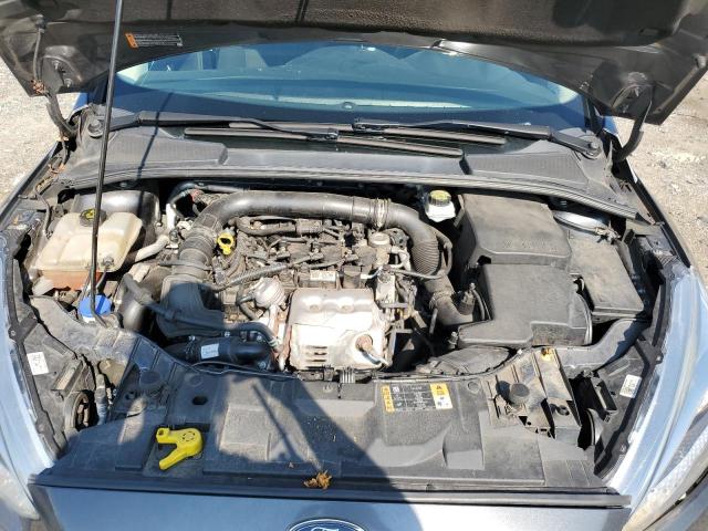 Foto 11 de la subasta – 2018 FORD FOCUS SE con VIN 1FADP3FEXJL208183