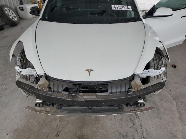 Photo 11 from auction – 2021 TESLA MODEL 3 with VIN 5YJ3E1EA4MF985500