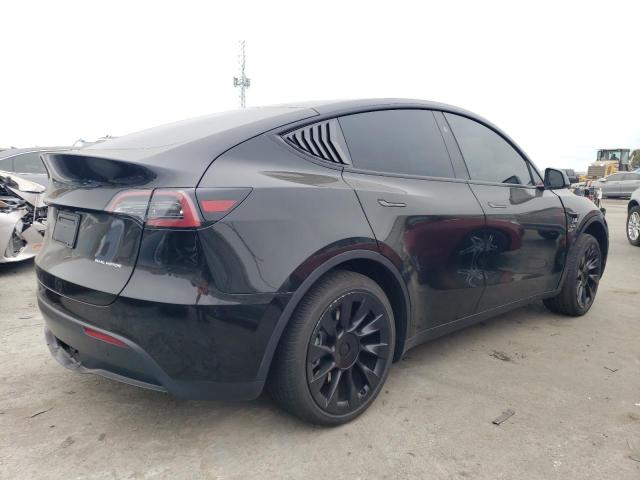 Photo 3 from auction – 2023 TESLA MODEL Y with VIN 7SAYGAEE6PF899504