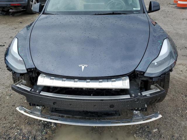 Photo 11 from auction – 2023 TESLA MODEL Y with VIN 7SAYGDEE5PA178024