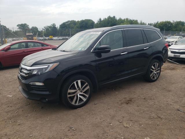 HONDA PILOT TOUR 2016 with VIN 5FNYF6H93GB079764 - Photo from auction